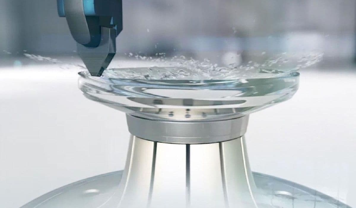 ZEISS freeform lens surfacing — a precision cutting tool machining a lens blank in production